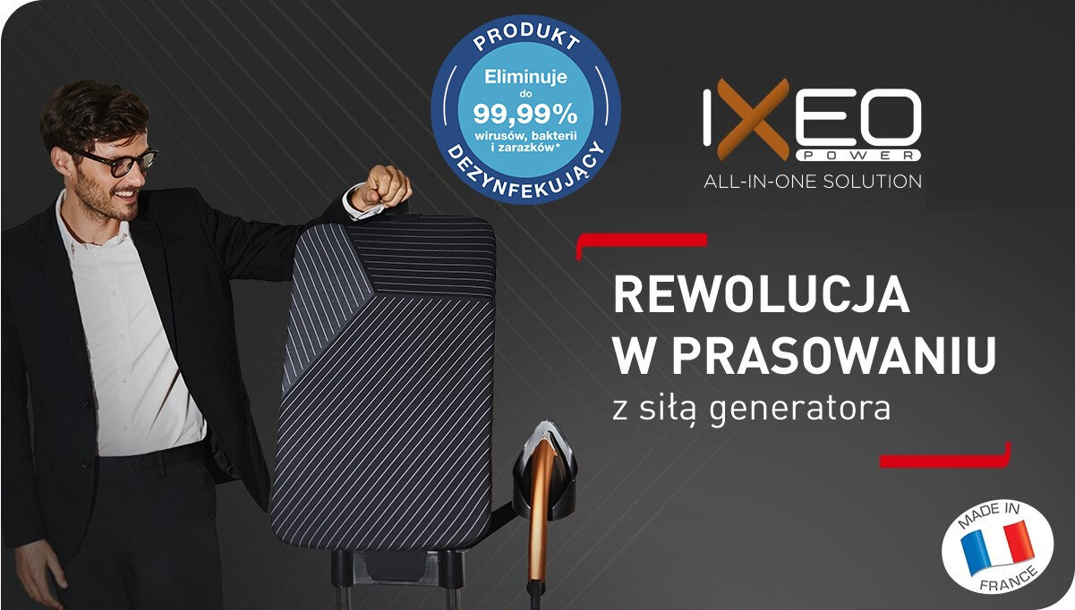 Mężczyzna w okularach stoi obok systemu do prasowania z napisem \'REWOLUCJA W PRASOWANIU z siłą generatora\'. Na górze widnieje logo \'IXEO POWER\' oraz okrągły znak z napisem \'Eliminuje do 99,99% wirusów, bakterii i zarazków\'.