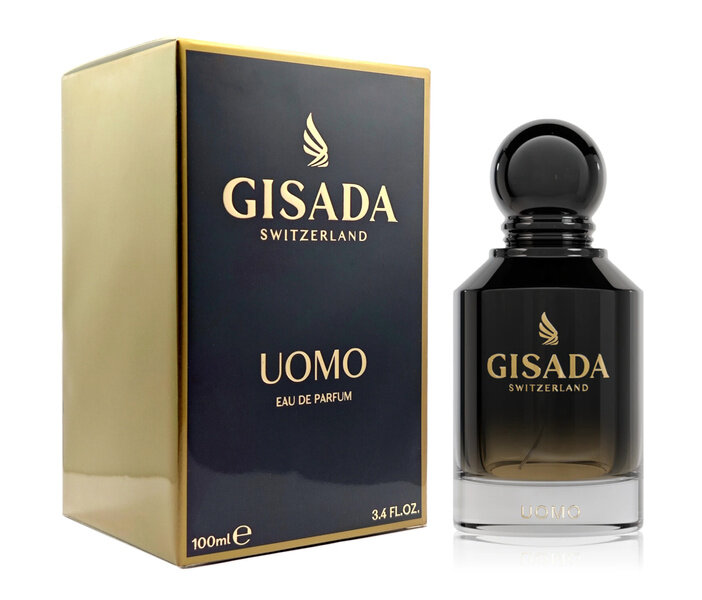 Na obrazie widoczna jest butelka perfum oraz pudełko z napisem \'GISADA SWITZERLAND UOMO EAU DE PARFUM\'. Pojemność wynosi 100 ml, a na pudełku znajduje się dodatkowy napis \'3.4 FL.OZ.\'.