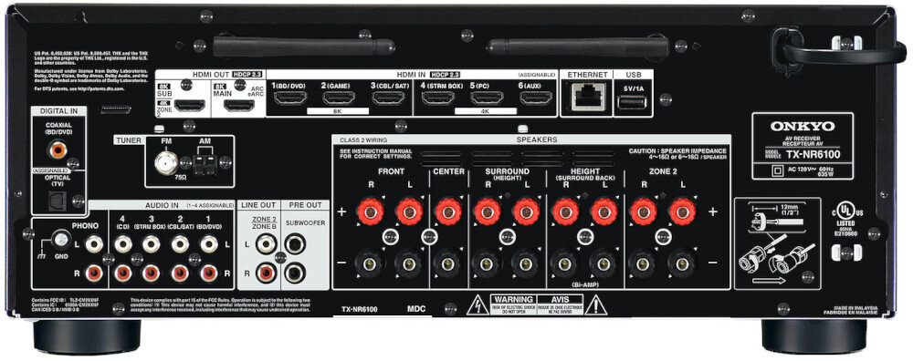 Tył amplitunera z różnymi złączami, w tym HDMI, Ethernet, USB oraz wejściami i wyjściami audio. Widoczne logo \'ONKYO\' oraz model \'TX-NR6100\'.