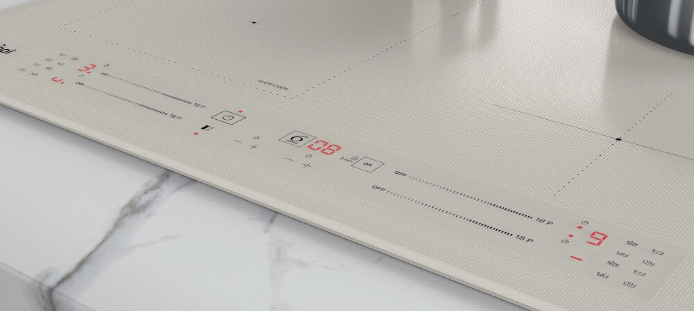 Na obrazie widoczna jest płyta indukcyjna w jasnym kolorze z panelem dotykowym i wyświetlaczem cyfrowym. Na panelu znajdują się oznaczenia funkcji oraz logo \'Whirlpool\'.