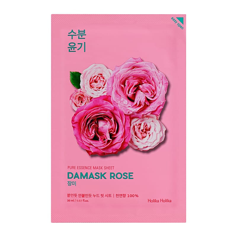 Opakowanie maseczki w płachcie nawilżającej z różami na różowym tle. Tekst na opakowaniu: \'PURE ESSENCE MASK SHEET DAMASK ROSE 20 ml / 0.67 fl.oz.\' oraz \'Holika Holika\'.