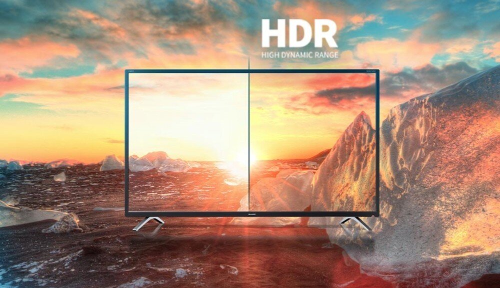 Telewizor SHARP 43HL4765E, HDR10, kontrastowy obraz, naturalne kolory, wyraziste jasne sceny i szczegóły w cieniach, telewizor na tle wschodzącego słońca