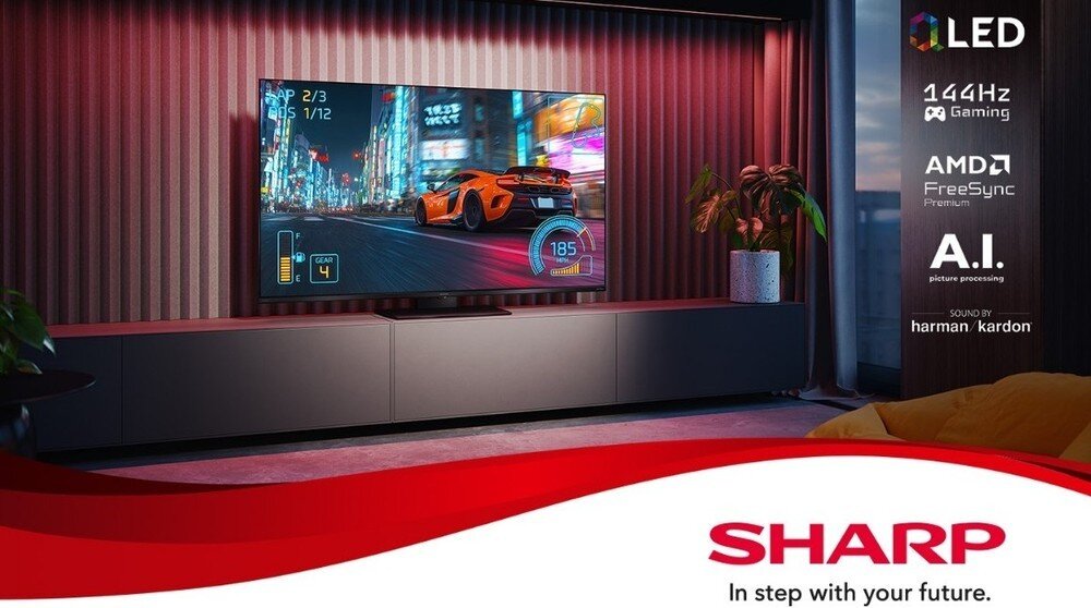 Telewizor SHARP 65JR7765E, gaming 144 Hz, technologia QLED, płynny obraz i funkcje dla graczy, telewizor stojący na komodzie w pomieszczeniu