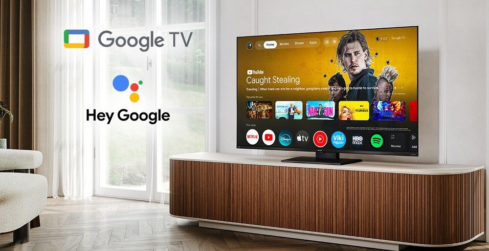 Telewizor SHARP 65JT8765E z Google TV, ponad 7000 aplikacji, Netflix, Disney+, Prime Video i sterowanie głosowe Google Assistant, telewizor stojący na komodzie w pomieszczeniu