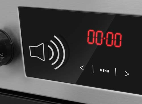 Panel sterowania piekarnika z wyświetlaczem LED pokazującym \'00:00\' oraz ikoną głośnika. Widoczne są przyciski z napisem \'MENU\' i strzałkami wskazującymi kierunki.