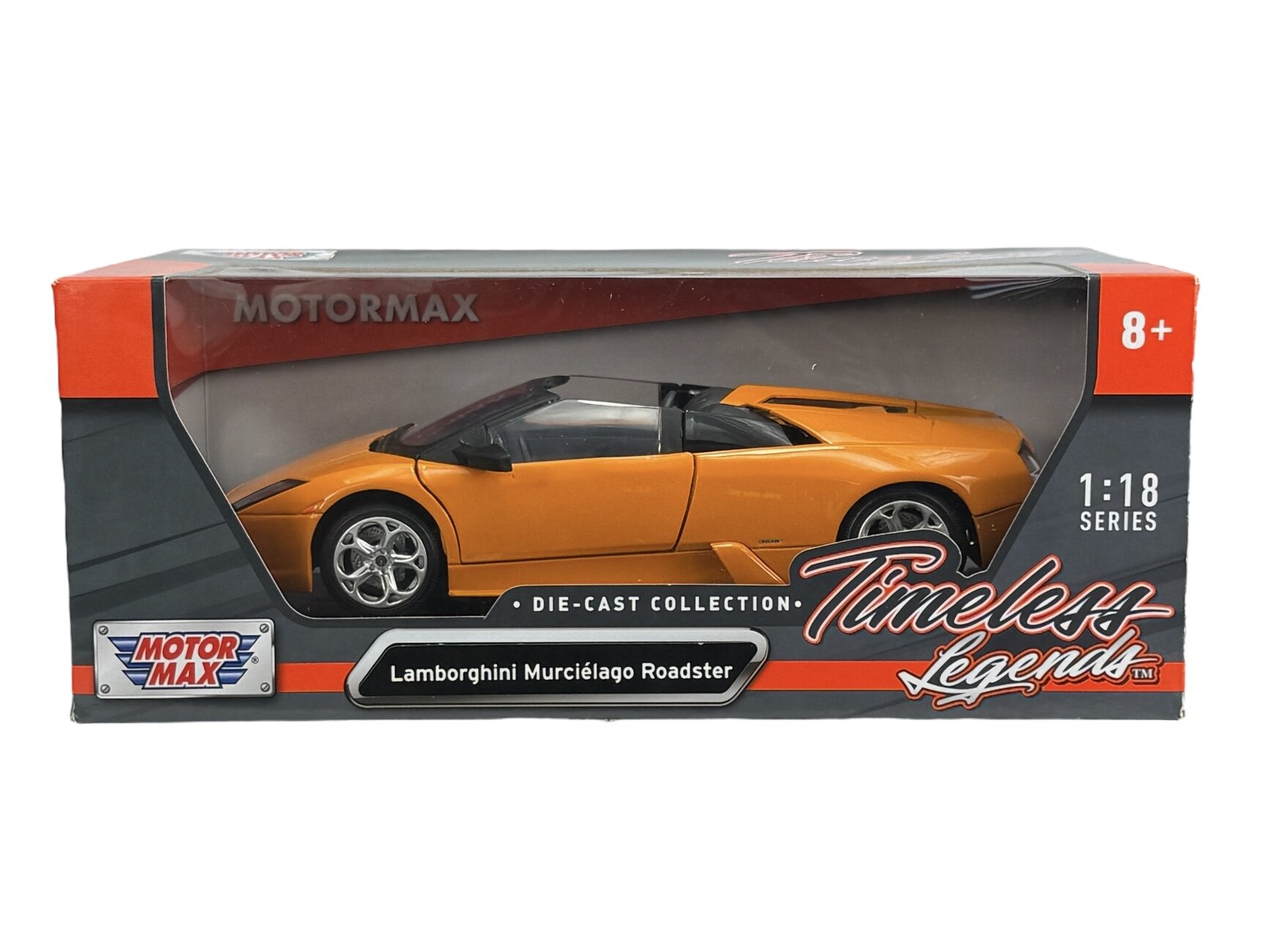 Pomarańczowy model samochodu Lamborghini Murciélago Roadster w skali 1:18 znajduje się w pudełku z napisem \'Motormax\', \'Die-Cast Collection\', \'Timeless Legends\'.