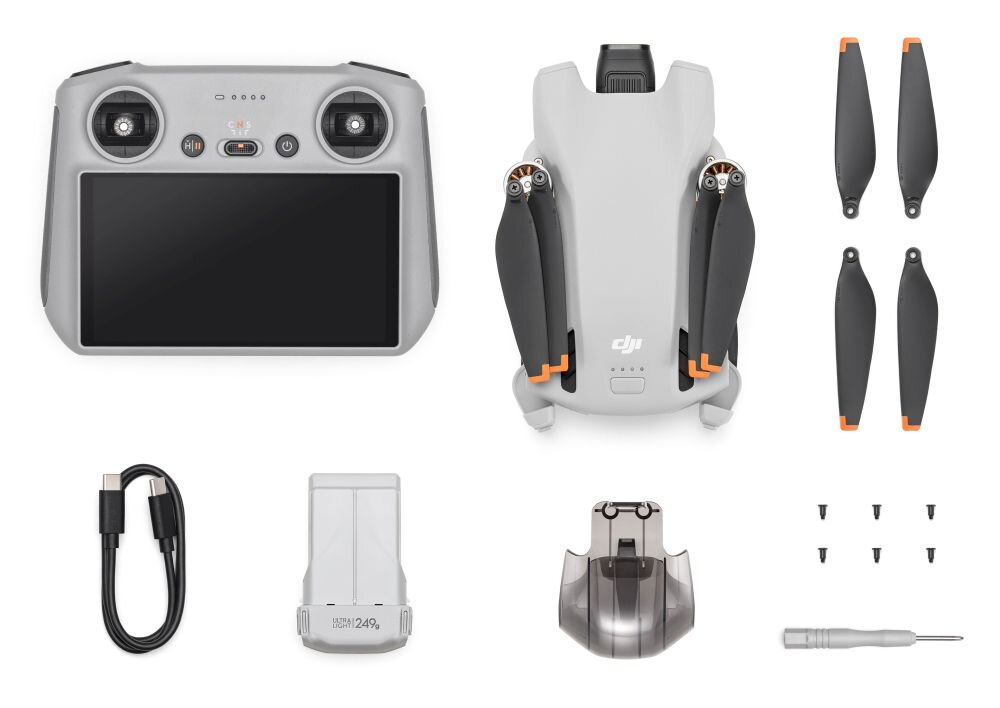 Na obrazie widoczny jest zestaw drona, w skład którego wchodzą: kontroler z ekranem, złożony dron z logo DJI, cztery śmigła, kabel USB-C, bateria z napisem \'249g\', osłona na kamerę, sześć śrubek i śrubokręt.