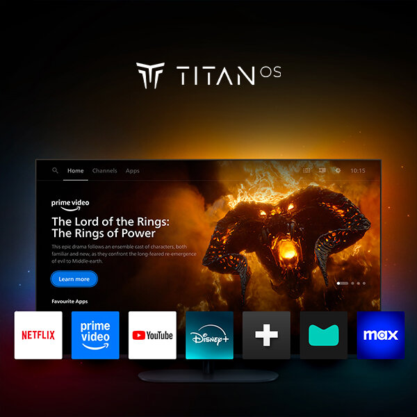 Obraz przedstawia ekran telewizora z interfejsem systemu Titan OS, na którym wyświetlana jest aplikacja Prime Video z tytułem \'The Lord of the Rings: The Rings of Power\'. Poniżej ekranu widoczne są ikony aplikacji: Netflix, Prime Video, YouTube, Disney+, oraz inne.