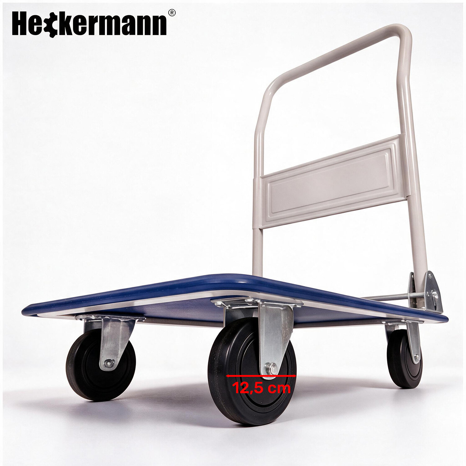 Na obrazie widoczny jest niebieski wózek magazynowy z czterema kołami, z logo \'Heckermann\' w lewym górnym rogu. Na jednym z kół znajduje się oznaczenie \'12,5 cm\'.