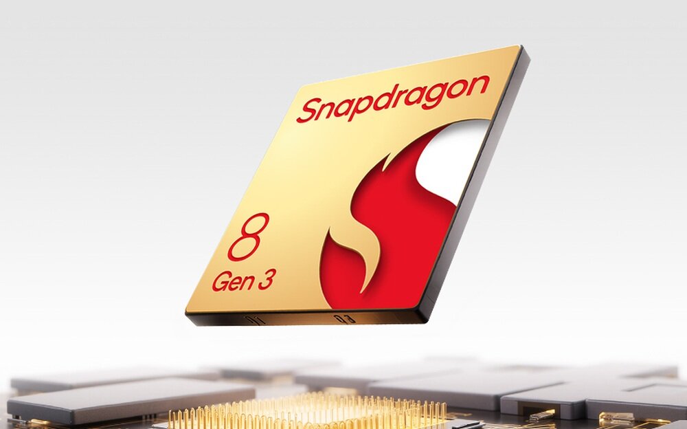 Obraz przedstawia układ scalony z napisem \'Snapdragon 8 Gen 3\' na złotym tle z czerwonym symbolem płomienia.