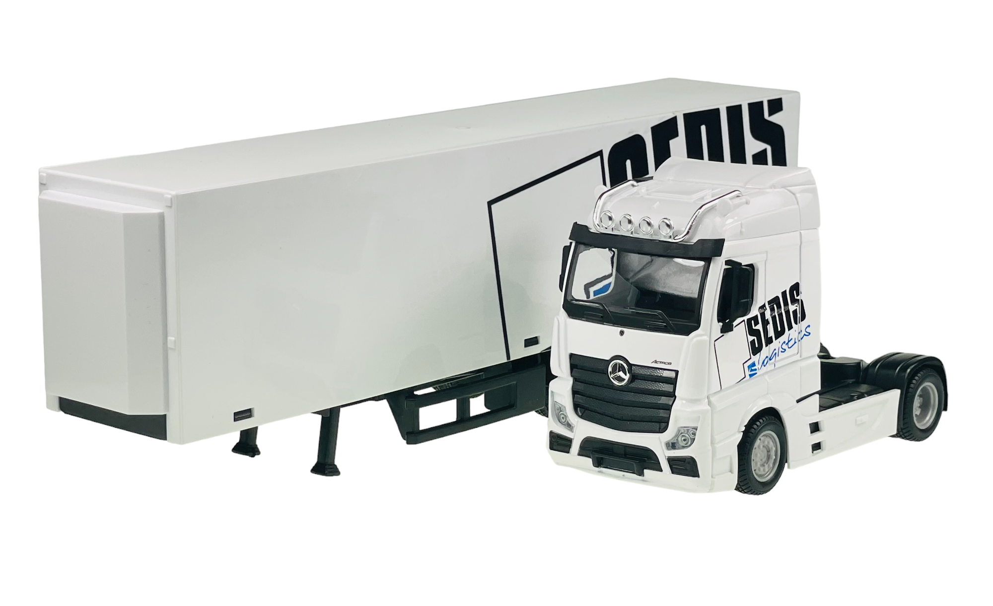 Model ciężarówki Mercedes Actros w białym kolorze z naczepą, na której widnieje napis \'SEDIS\'.