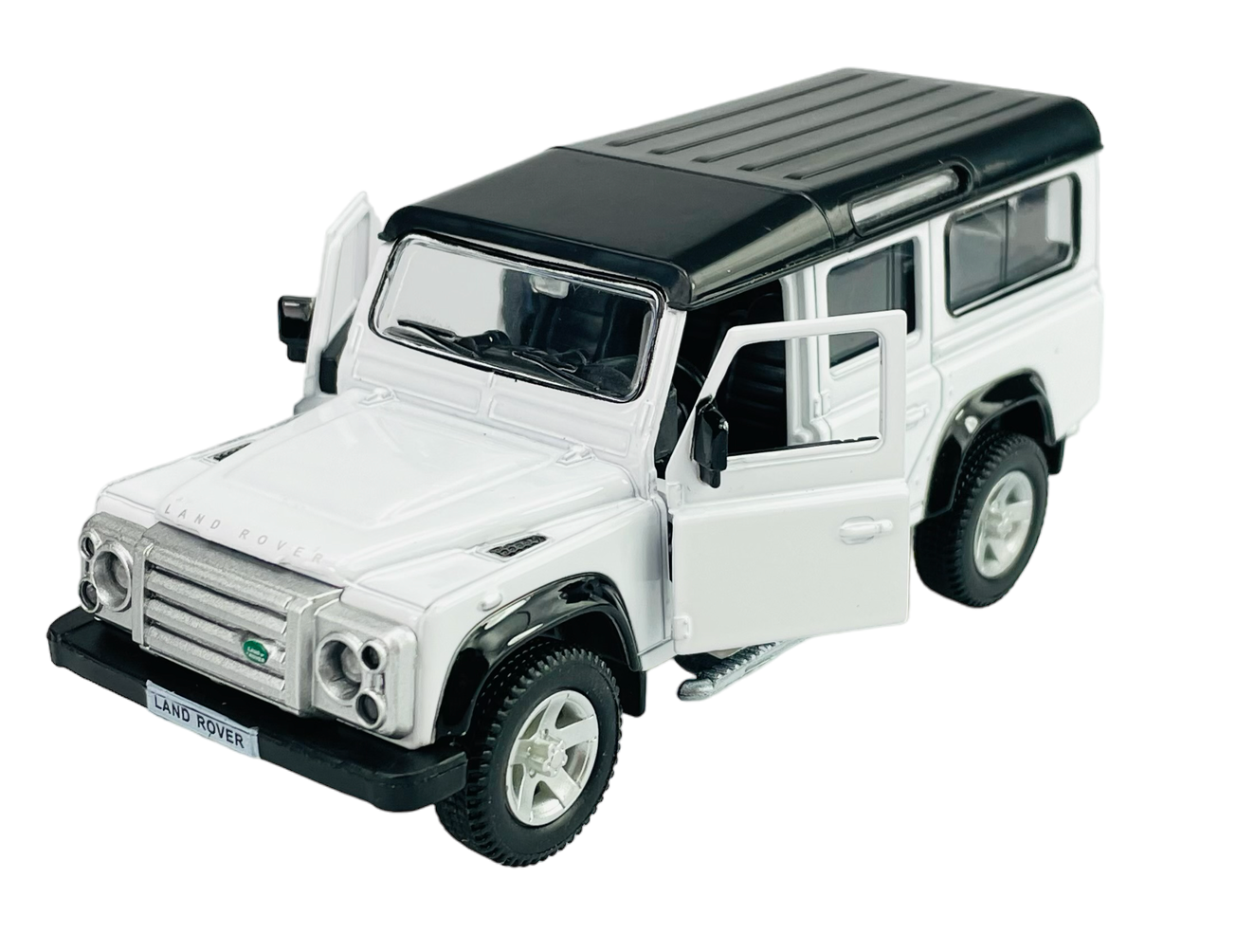 Model samochodu Land Rover Defender w kolorze białym z otwartymi drzwiami i czarnym dachem. Na przodzie widoczny jest napis \'LAND ROVER\'.