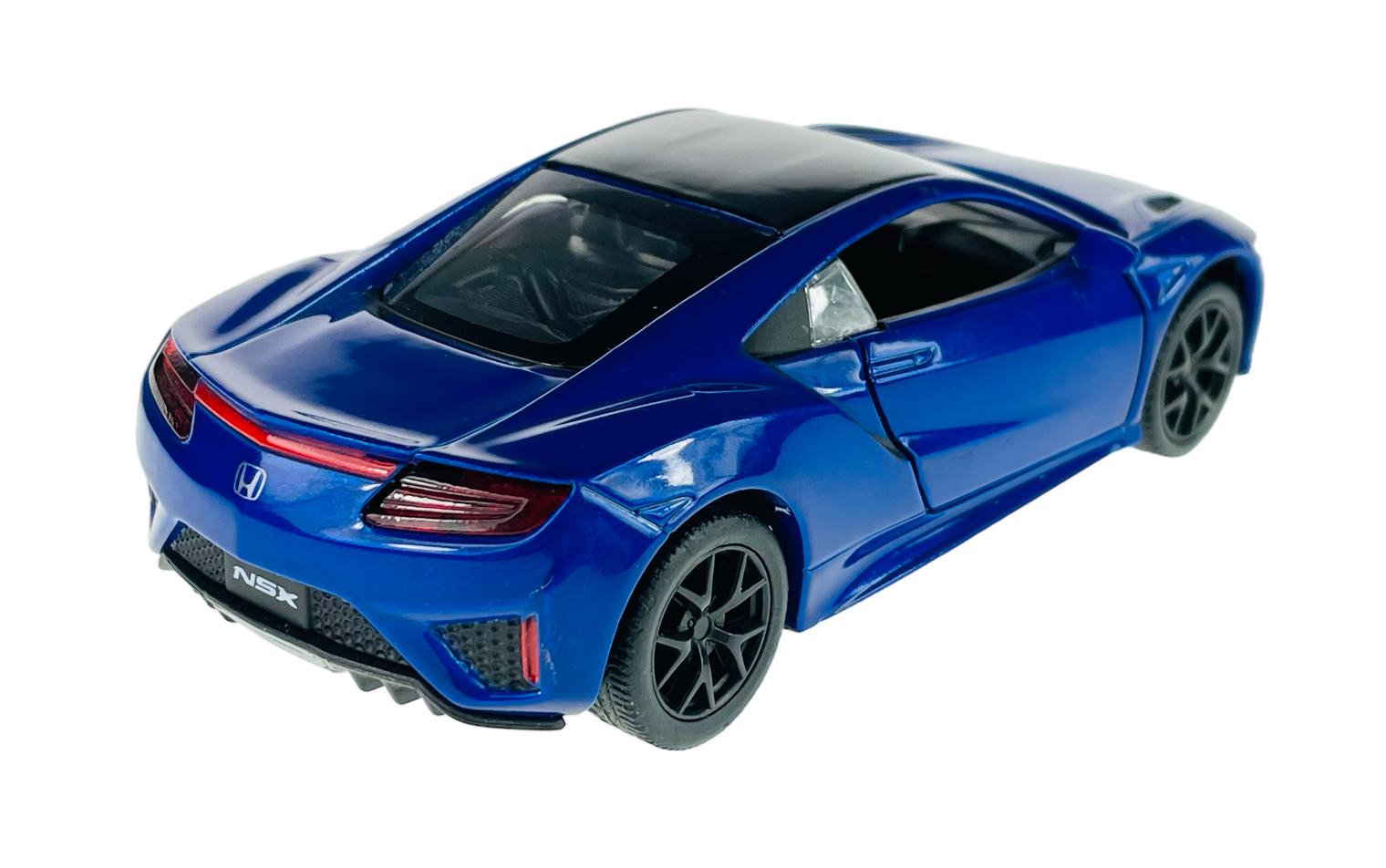 Model samochodu w kolorze niebieskim z czarnym dachem, przedstawiający sportowy design z widocznym logo Honda z tyłu. Na tablicy rejestracyjnej widnieje napis \'NSX\'.