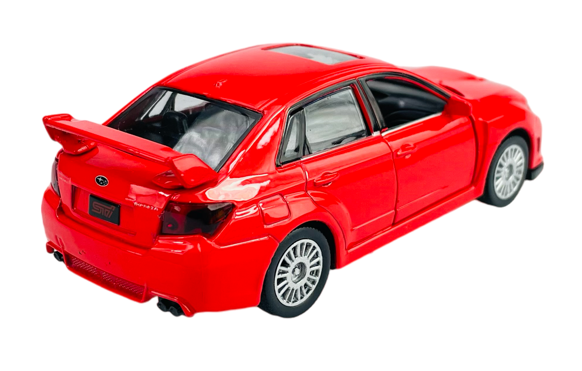 Czerwony model samochodu Subaru Wrx Sti z widocznym tylnym spojlerem i szczegółowymi felgami. Na tylnej klapie znajduje się logo Subaru oraz napis \'STI\'.