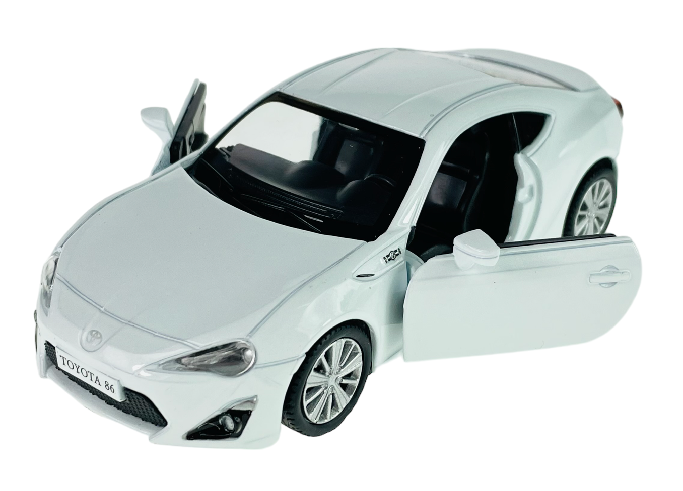 Biały model samochodu Toyota 86 z otwartymi drzwiami i widocznym wnętrzem. Na tablicy rejestracyjnej widnieje napis \'TOYOTA 86\'.