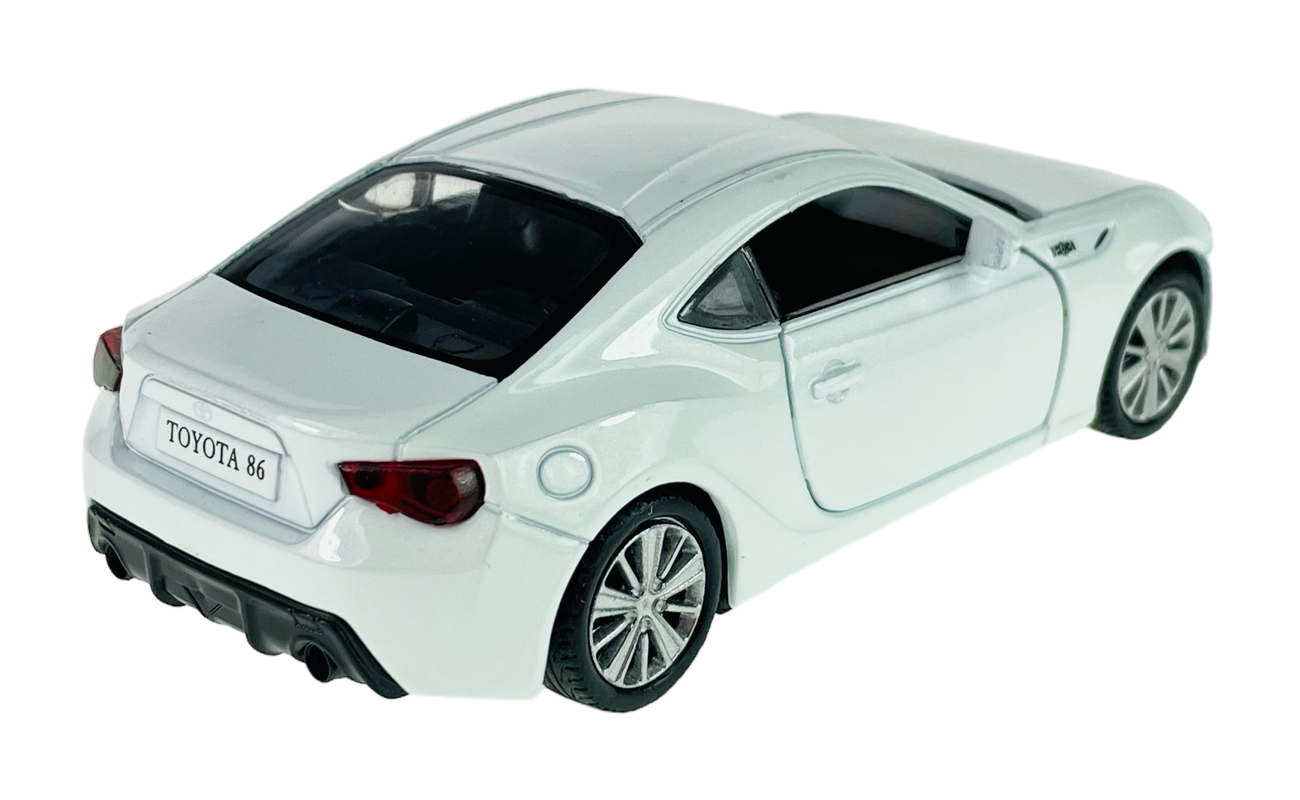 Model samochodu w kolorze białym z napisem \'TOYOTA 86\' na tablicy rejestracyjnej. Posiada szczegółowe elementy, takie jak reflektory i felgi.