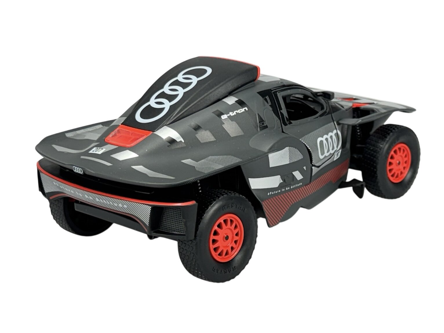 Model samochodu w skali 1:24 przedstawiający Audi RS Q e-tron w kolorze szarym z czerwonymi felgami. Na karoserii widoczne są logo Audi oraz napisy \'e-tron\' i \'Vorsprung durch Technik\'.