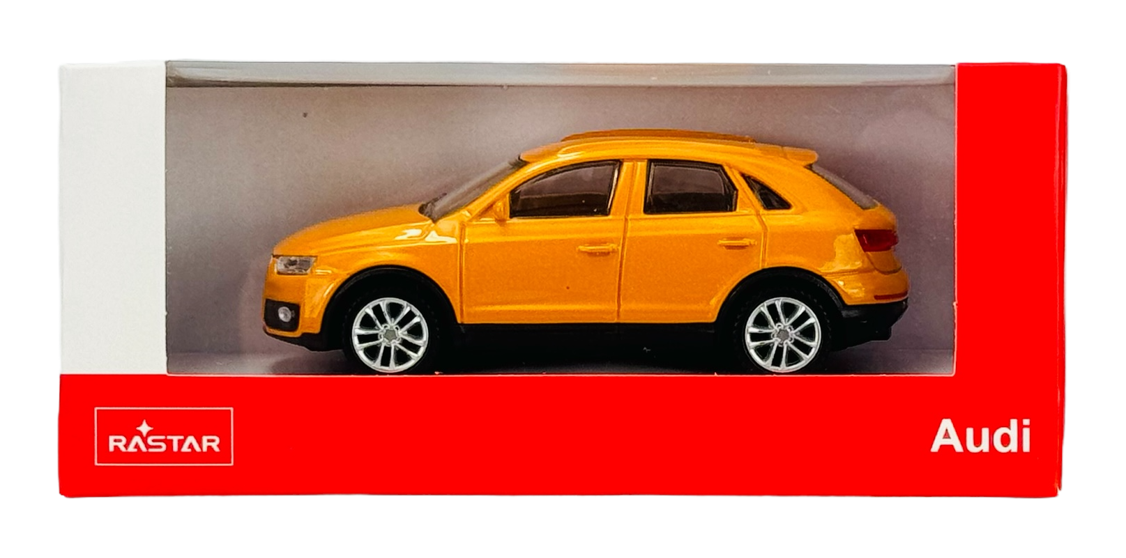 Model samochodu w kolorze pomarańczowym w skali 1:43 znajduje się w opakowaniu z logo \'RASTAR\' i napisem \'Audi\'.