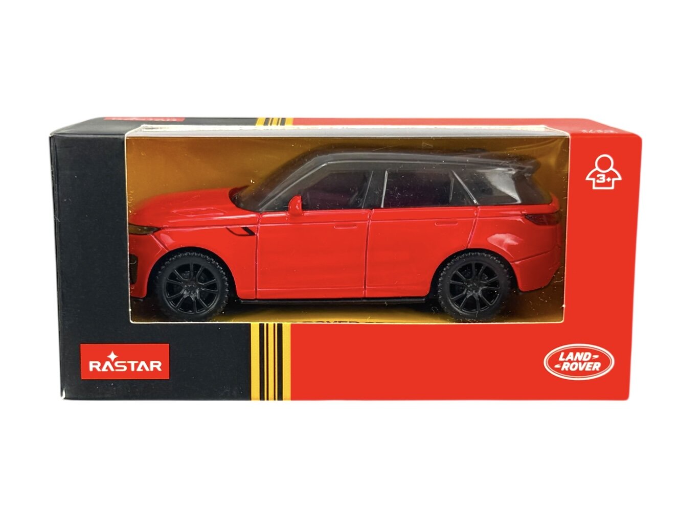 Czerwony model samochodu Range Rover Sport w skali 1:43 znajduje się w pudełku z przezroczystym frontem. Na opakowaniu widoczne są loga \'RASTAR\' i \'LAND ROVER\'.