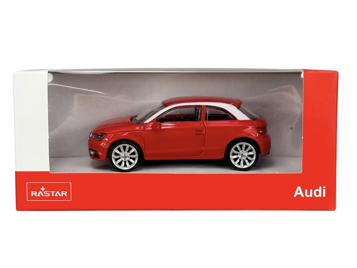 Model samochodu w kolorze czerwonym znajduje się w pudełku z przezroczystym frontem. Na opakowaniu widoczne są napisy \'RASTAR\' i \'Audi\'.