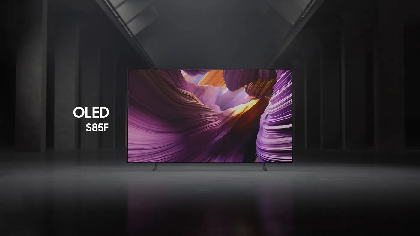 Telewizor z wyświetlaczem OLED prezentuje kolorowy obraz przypominający abstrakcyjne formy skalne. Obok ekranu widoczny jest napis \'OLED S85F\'.