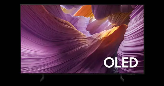 664x352-s85f Telewizor wyświetla kolorowy obraz z abstrakcyjnymi, falistymi kształtami w odcieniach fioletu i pomarańczu. W prawym dolnym rogu widoczny jest napis \'OLED\'.