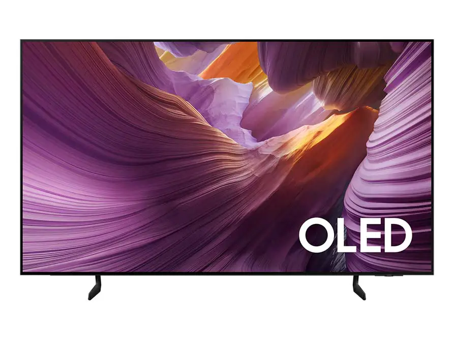 893x668-s85f Telewizor z wyświetlaczem OLED pokazuje kolorowy, abstrakcyjny obraz z dominującymi odcieniami fioletu i pomarańczu. W prawym dolnym rogu widoczny jest napis \'OLED\'.