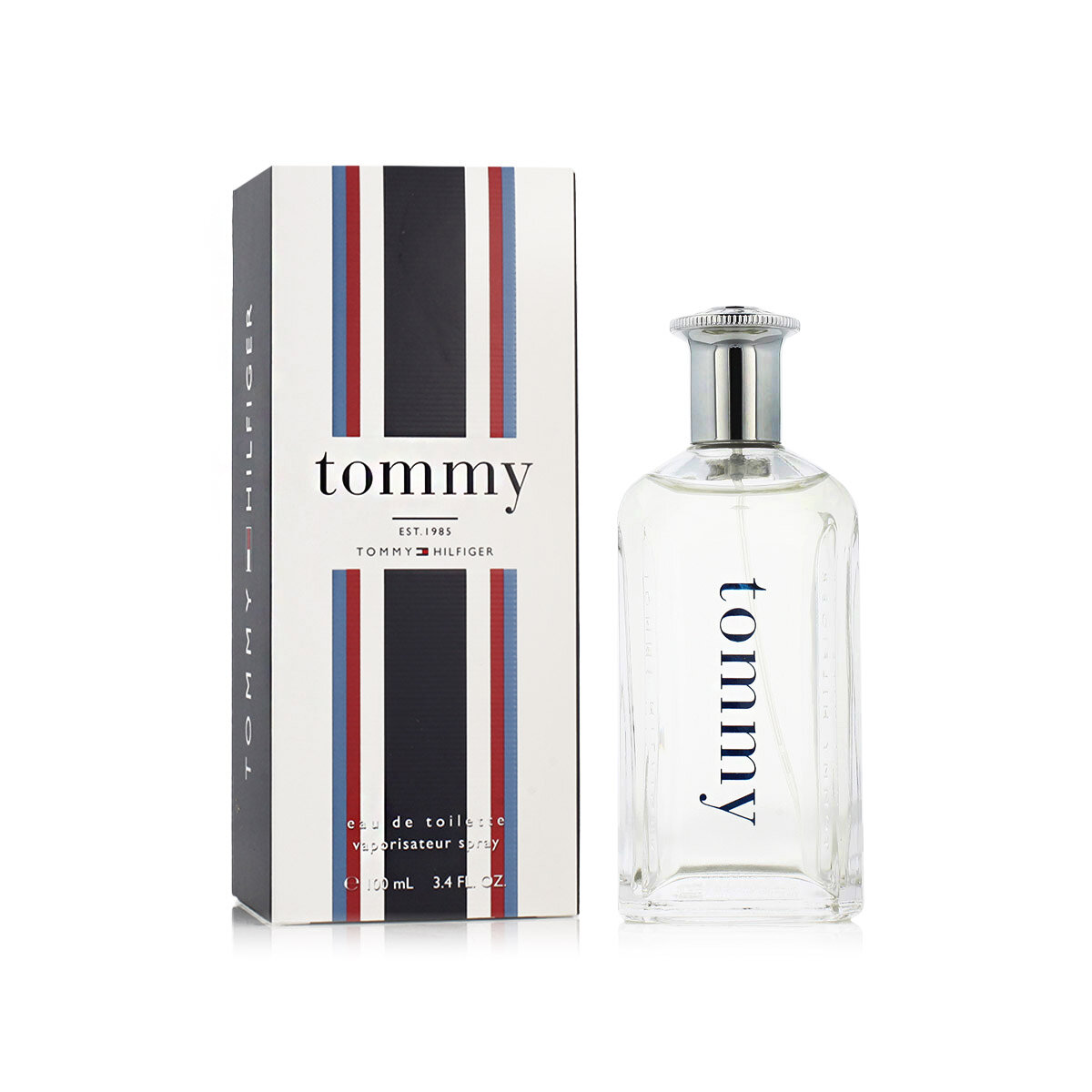 Na obrazie widoczny jest flakon perfum oraz pudełko z napisem \'tommy EST. 1985 TOMMY HILFIGER\'. Flakon jest przezroczysty z metalowym korkiem, a pudełko ma pionowe paski w kolorach czerwonym, białym i niebieskim.