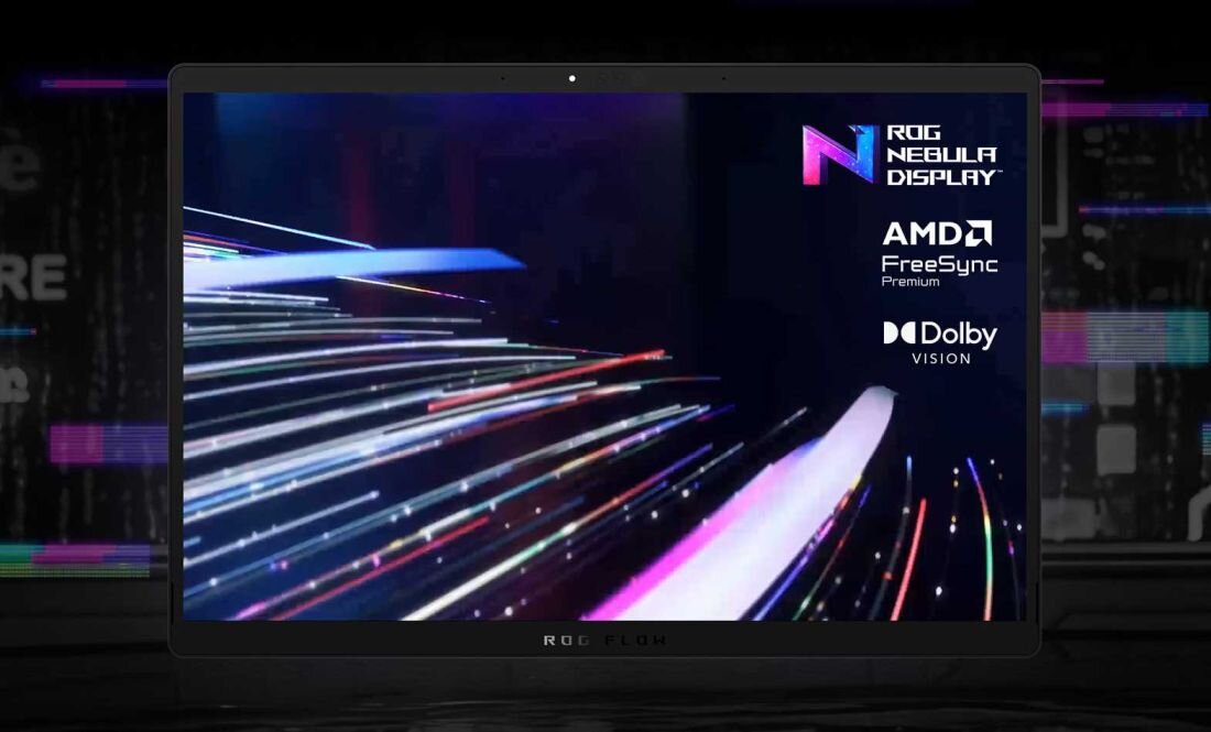 Ekran laptopa wyświetla dynamiczne, kolorowe linie na ciemnym tle. Widoczne są logotypy: ROG Nebula Display, AMD FreeSync Premium, Dolby Vision.