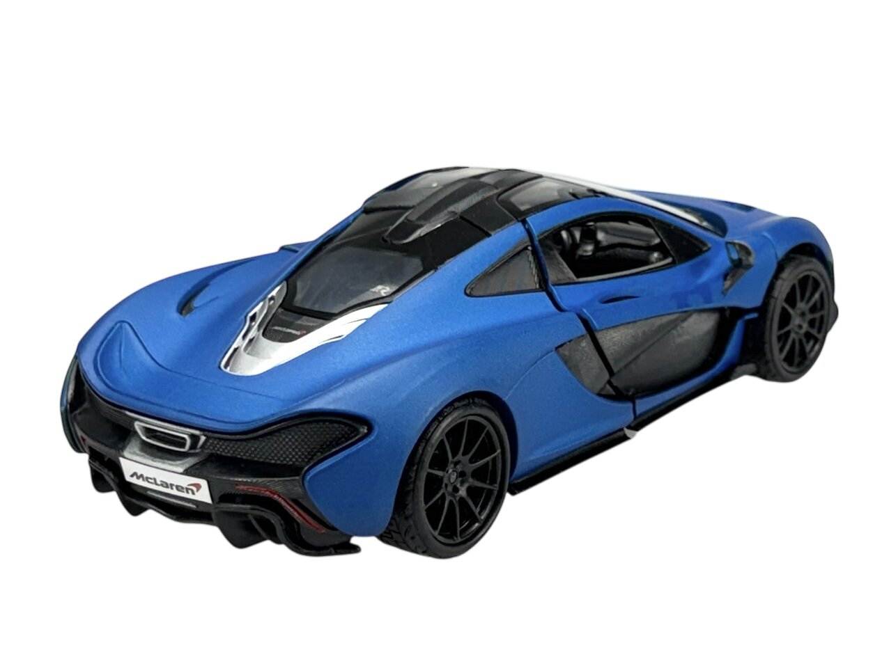 Model samochodu w kolorze niebieskim matowym z czarnymi detalami i przezroczystym dachem. Na tablicy rejestracyjnej widoczny jest napis \'McLaren\'.