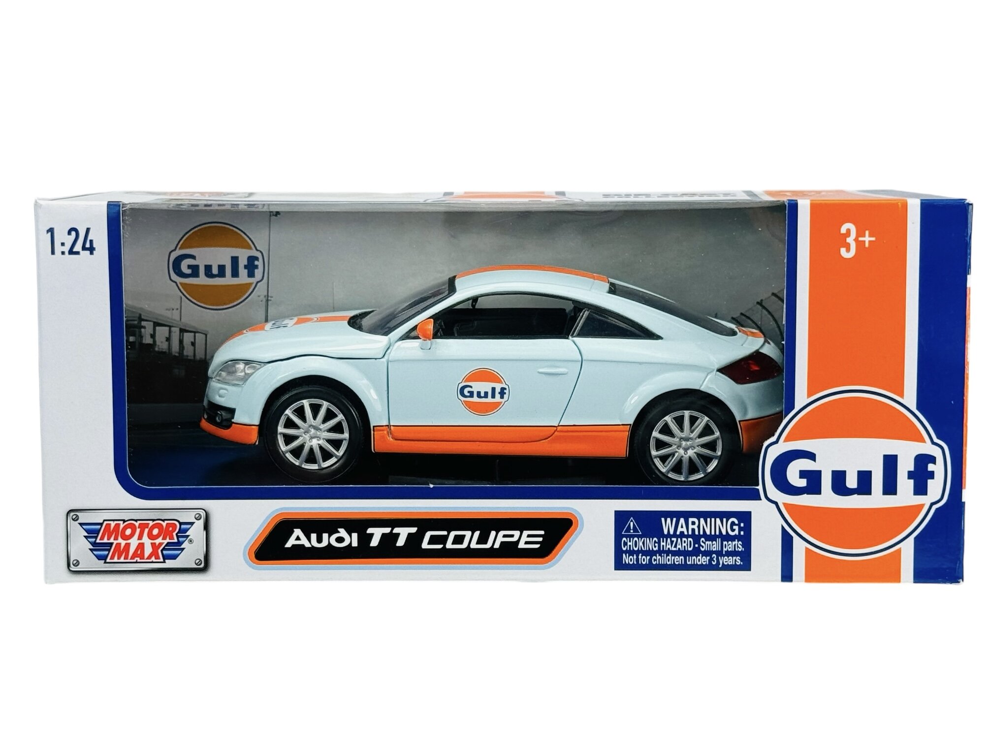 Model samochodu Audi TT Coupe w skali 1:24 w kolorach niebieskim i pomarańczowym z logo Gulf. Opakowanie zawiera ostrzeżenie: \'WARNING: CHOKING HAZARD - Small parts. Not for children under 3 years.\'