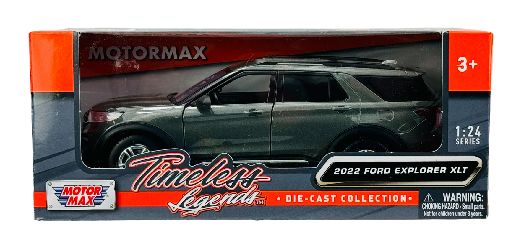 Model samochodu 2022 Ford Explorer XLT w kolorze grafitowym w skali 1:24, zapakowany w pudełko z napisem \'Timeless Legends\' oraz logo \'MOTORMAX\'. Na opakowaniu widnieje ostrzeżenie o ryzyku zadławienia dla dzieci poniżej 3 lat.