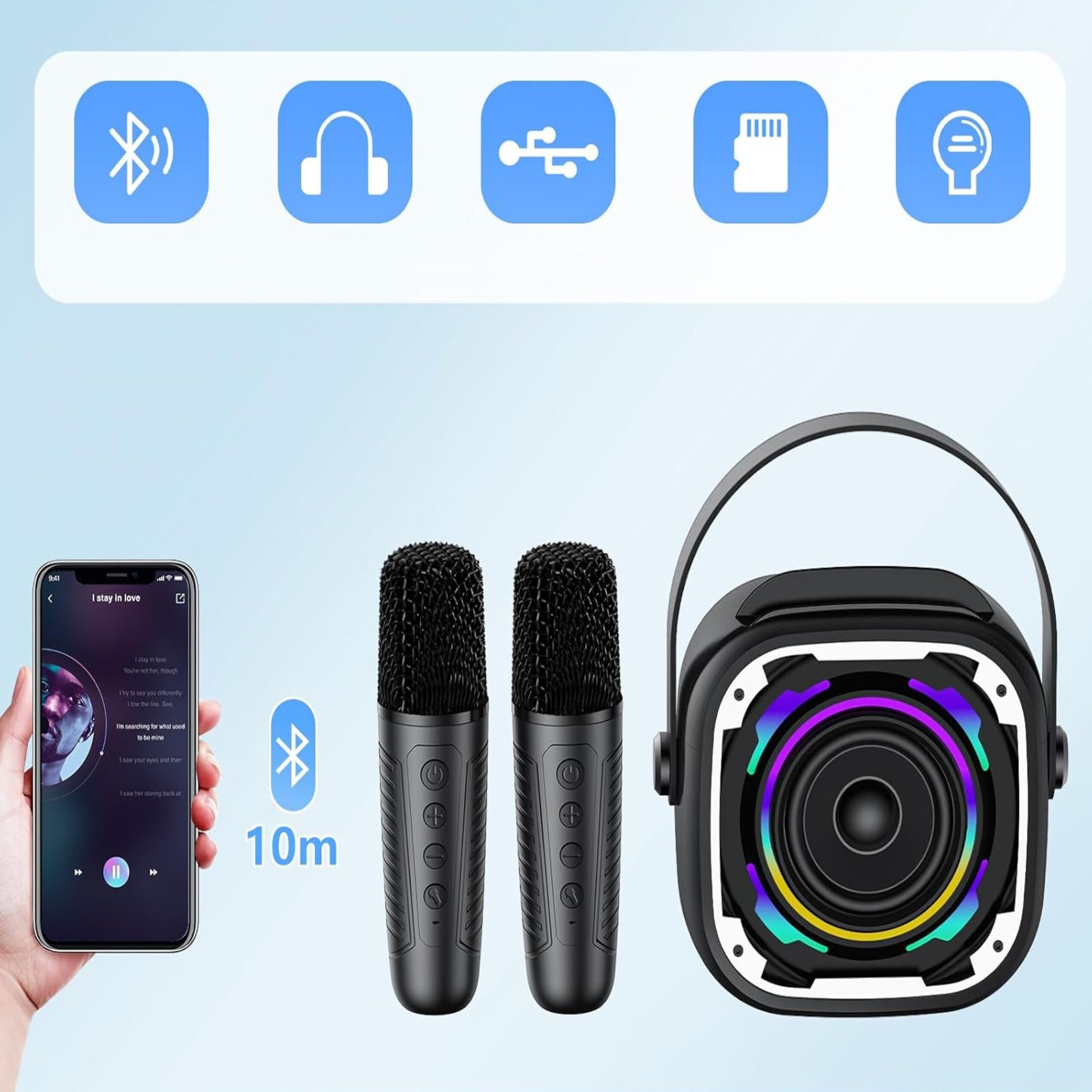Obraz przedstawia głośnik karaoke z efektami LED RGB, dwa mikrofony oraz uchwyt na telefon. Na górze widoczne są ikony: Bluetooth, słuchawki, USB, karta pamięci i mikrofon.