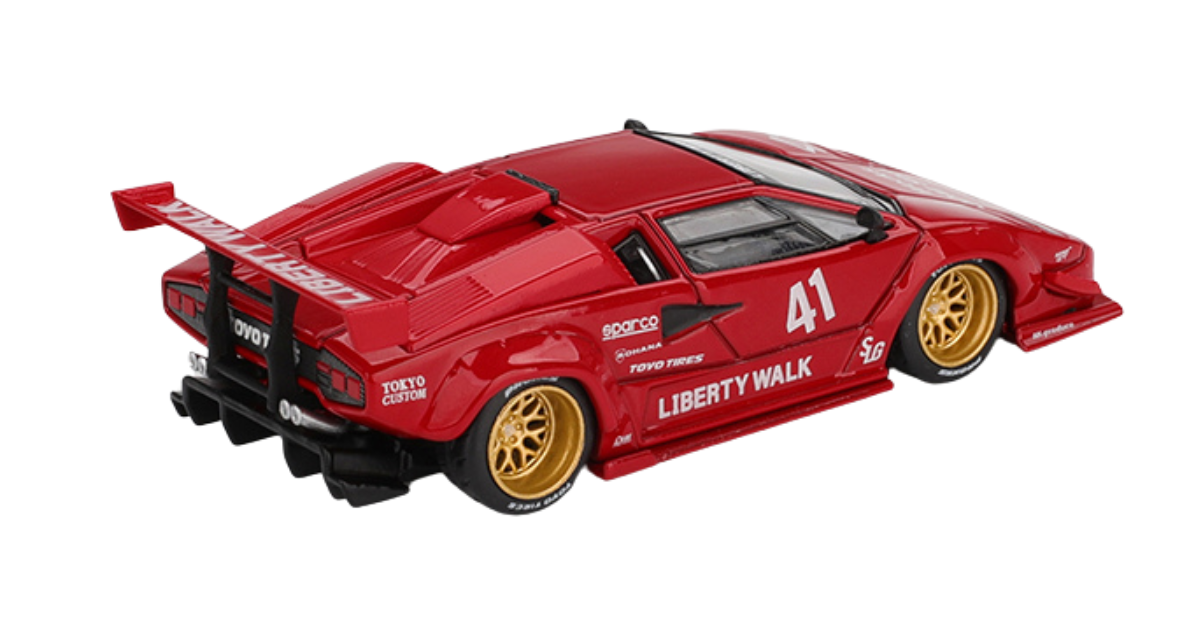Czerwony model samochodu sportowego z numerem 41 na boku, ozdobiony napisami \'LIBERTY WALK\' i \'TOYO TIRES\'. Posiada złote felgi i duży tylny spojler z napisem \'LIBERTY WALK\'.