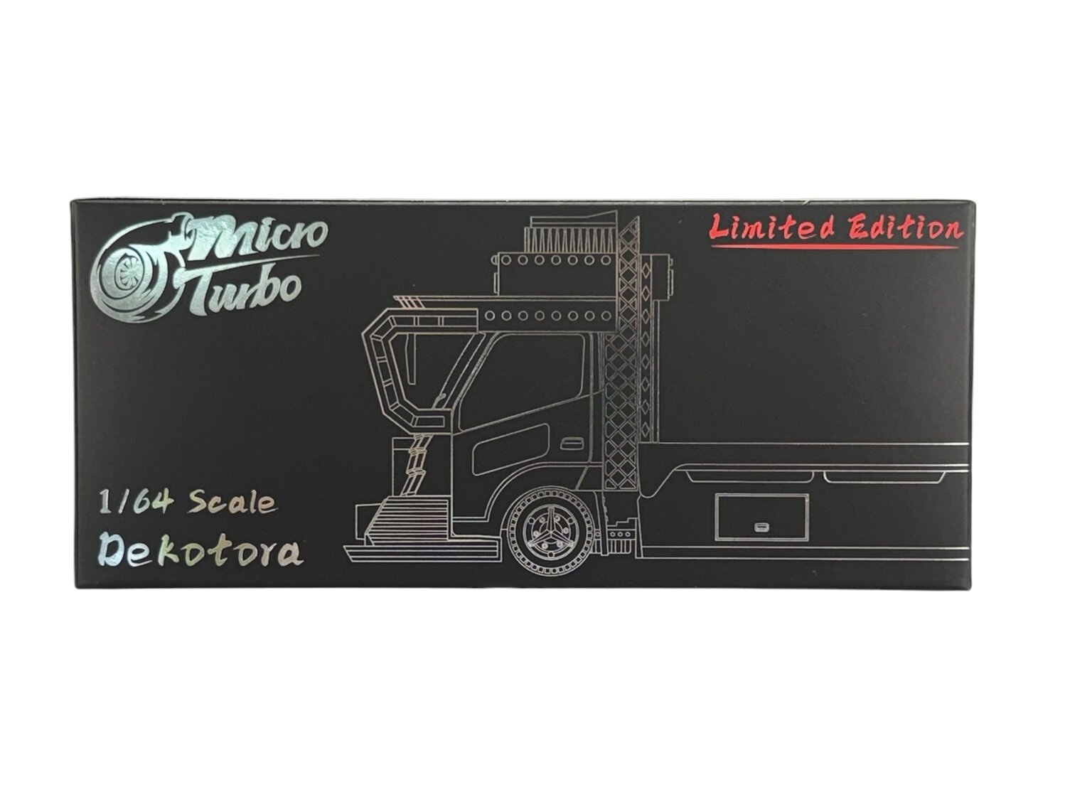 Czarne opakowanie z grafiką ciężarówki i napisami: \'Micro Turbo\', \'1/64 Scale Dekotora\', \'Limited Edition\'.