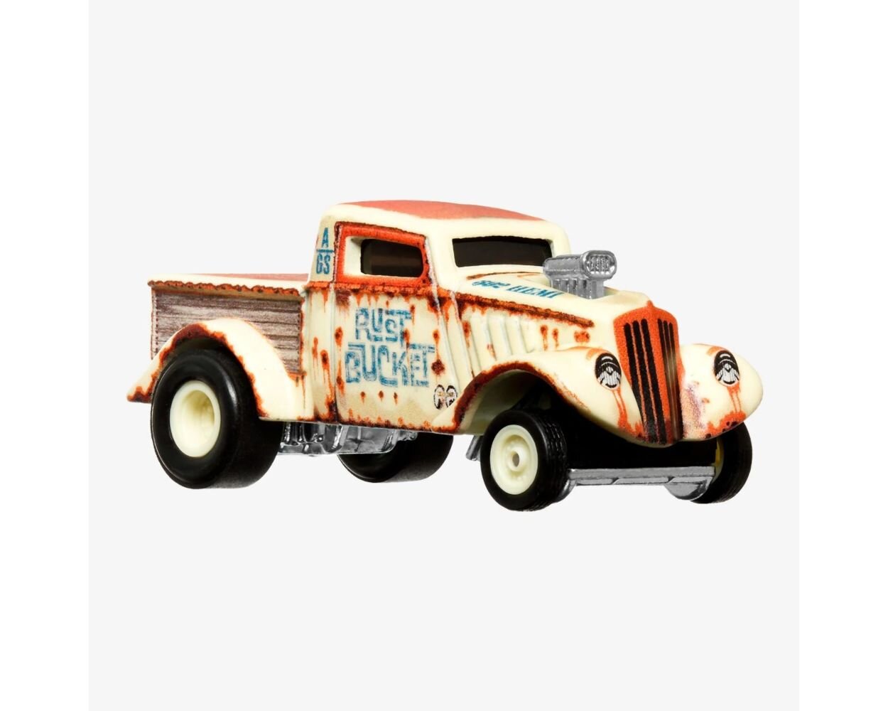 Model samochodu w stylu retro z napisem \'RUST BUCKET\' na boku, w kolorze kremowym z rdzawymi akcentami i czarnymi kołami.