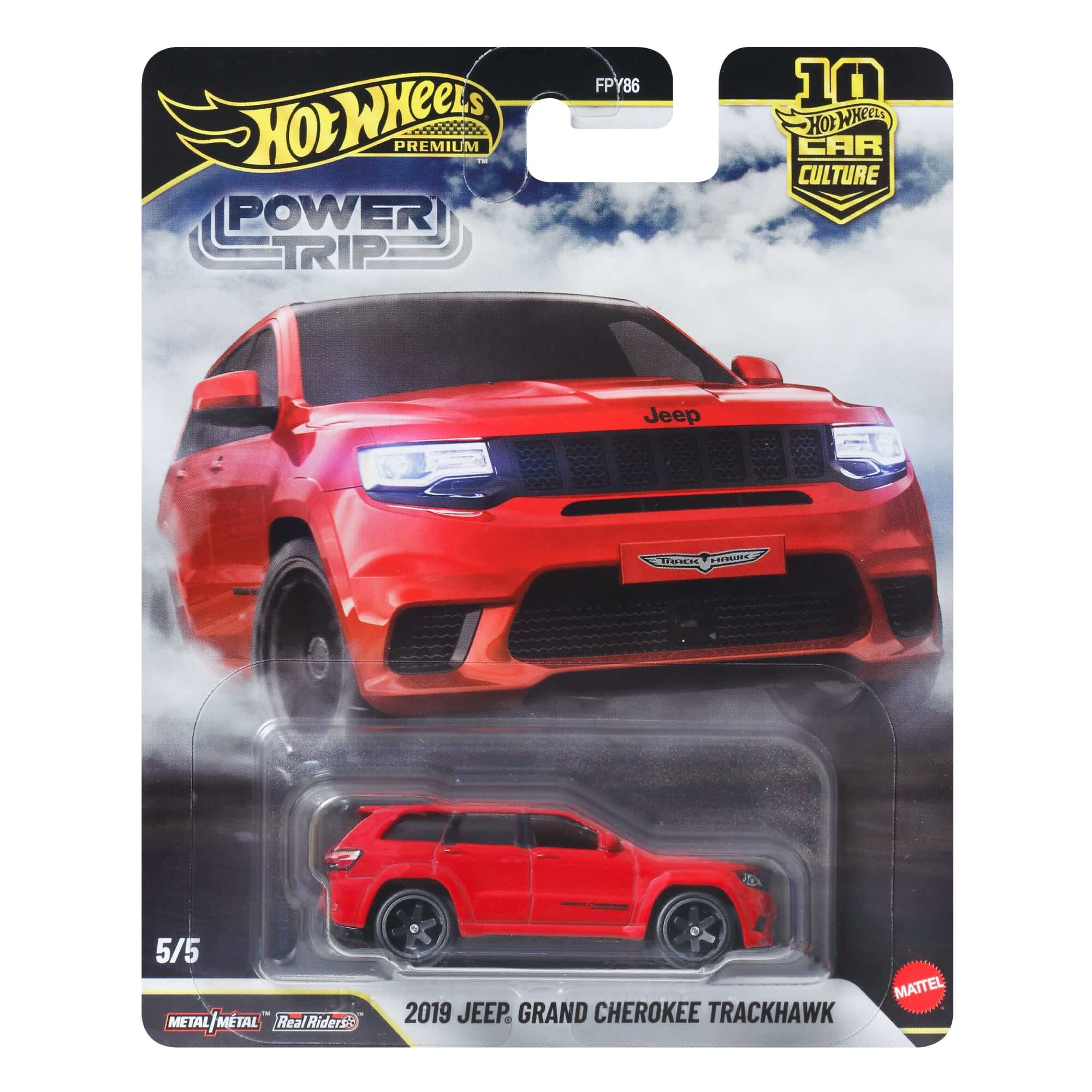 Opakowanie z modelem samochodu Hot Wheels Premium Power Trip, przedstawiające czerwony Jeep Grand Cherokee Trackhawk z 2019 roku. Na opakowaniu widoczne są napisy: \'Hot Wheels Premium\', \'Power Trip\', \'2019 JEEP GRAND CHEROKEE TRACKHAWK\', oraz logo Mattel.