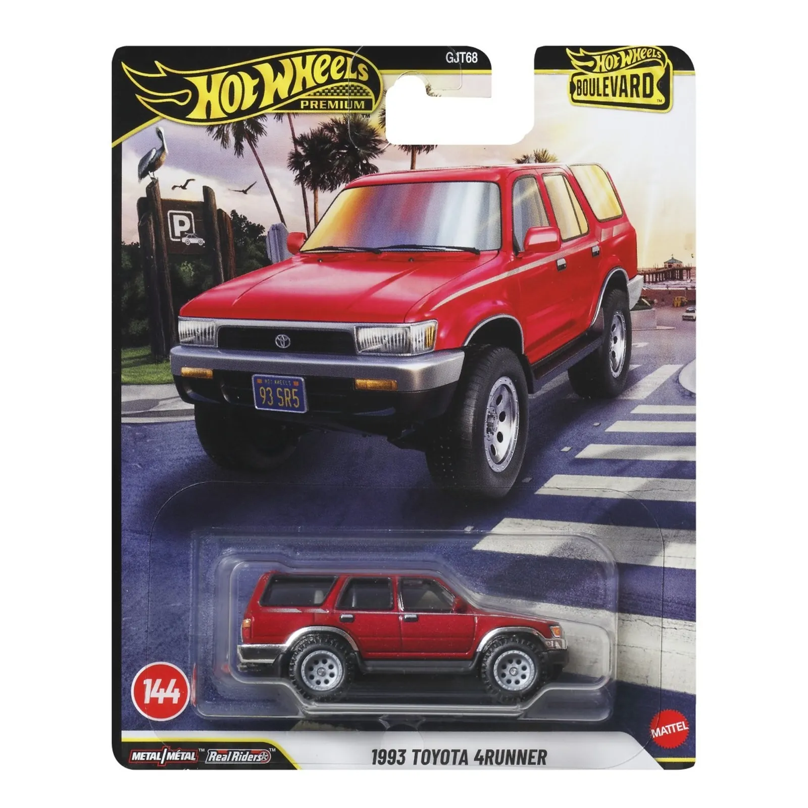 Opakowanie z modelem samochodu Hot Wheels Premium, przedstawiające czerwony pojazd terenowy z napisem \'1993 Toyota 4Runner\'. Widoczne są logotypy \'Hot Wheels Premium\' i \'Boulevard\', a także napis \'Metal/Metal Real Riders\'.
