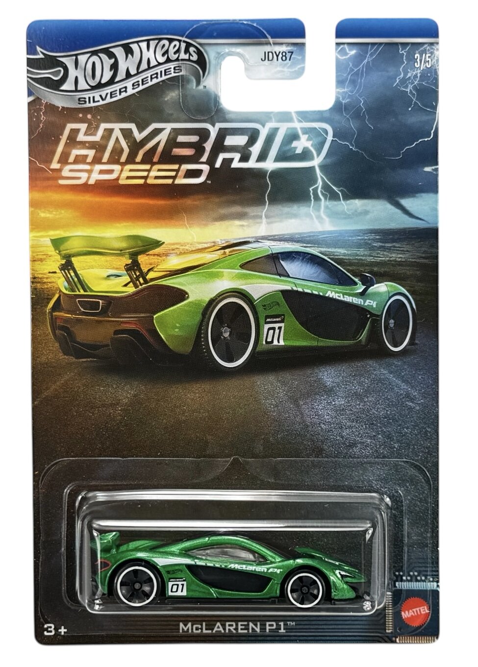 Opakowanie z modelem samochodu Hot Wheels z serii Silver Series, przedstawiające zielony samochód wyścigowy McLaren P1. Na opakowaniu widnieje napis \'HYBRID SPEED\' oraz logo \'Mattel\'.