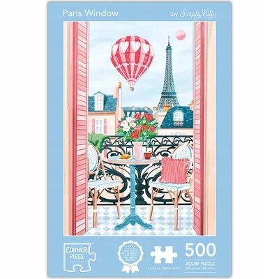 Obrazek przedstawia okno z widokiem na wieżę Eiffla, balon na ogrzane powietrze oraz balkon z dwoma krzesłami i stolikiem z kwiatami. Na opakowaniu puzzli widnieje napis \'Paris Window\', \'by Simply Katy\', \'Corner Piece\', \'500\'.