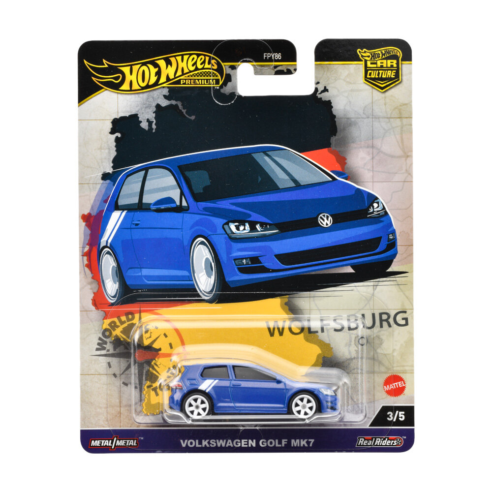 Opakowanie z modelem samochodu Hot Wheels Premium, przedstawiające niebieski Volkswagen Golf MK7. Widoczny tekst: \'WOLFSBURG\', \'VOLKSWAGEN GOLF MK7\', \'3/5\', \'Metal/Metal\', \'Real Riders\', \'Mattel\'.