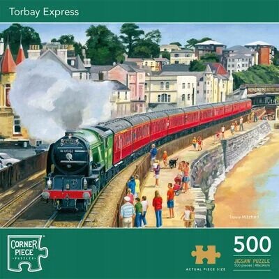 Obrazek przedstawia pociąg parowy na torach w nadmorskim miasteczku, z widocznymi budynkami w tle. Na dole znajduje się napis \'Torbay Express\', logo \'Corner Piece\', oraz informacja \'500 Jigsaw Puzzle\'.