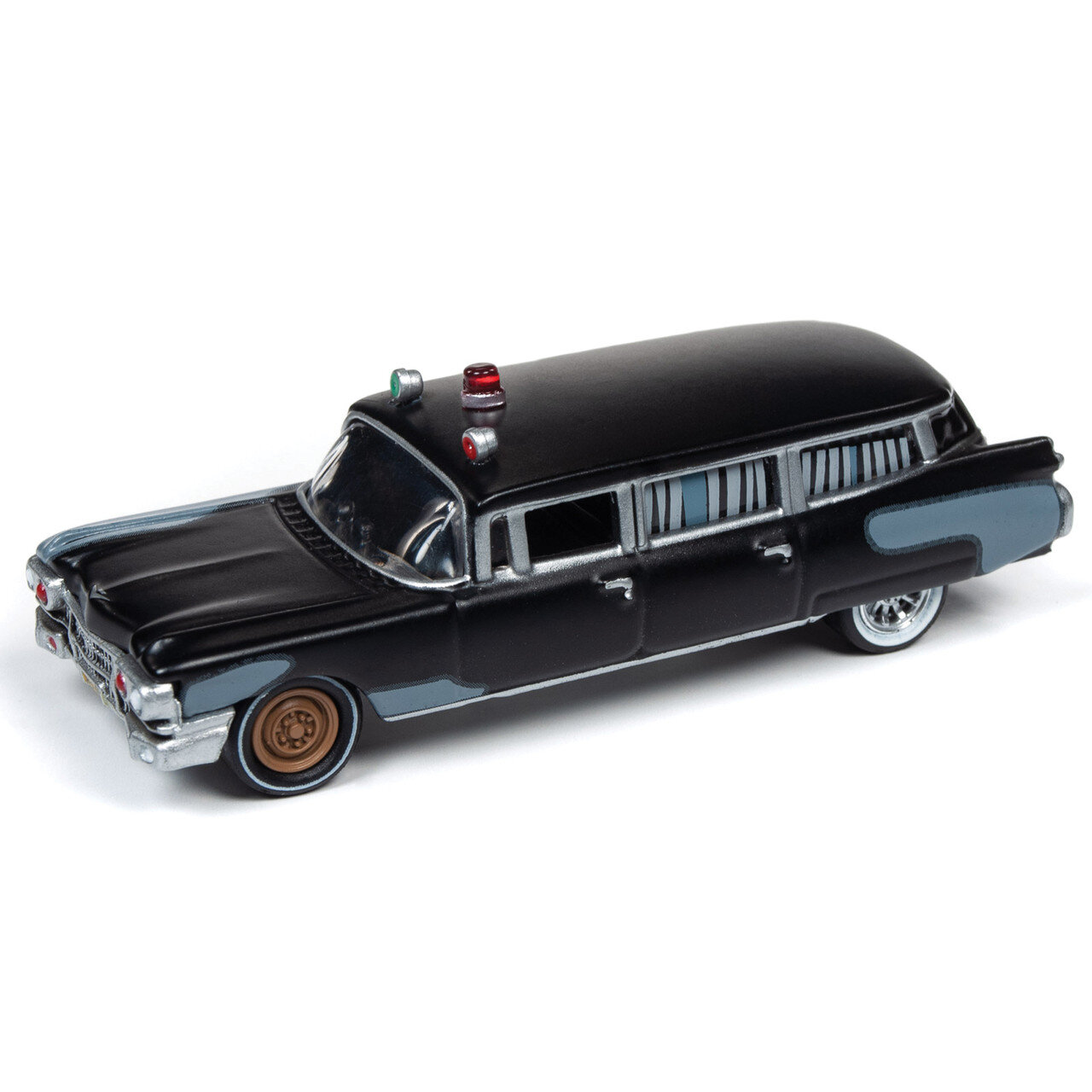 Model samochodu Cadillac z 1959 roku w skali 1:64, w kolorze czarnym z niebieskimi i srebrnymi detalami. Na dachu znajdują się czerwone i zielone światła sygnalizacyjne.