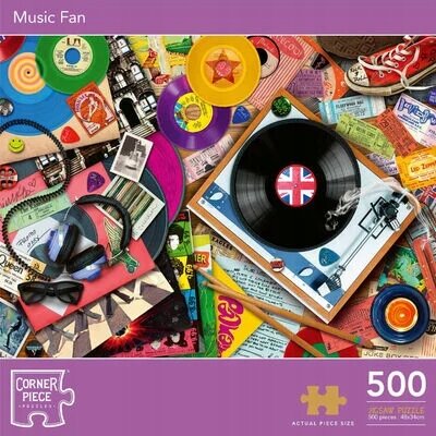 Obraz przedstawia kolorową układankę z motywami muzycznymi, w tym winyle, kasety i słuchawki. Na dole widnieje napis \'Corner Piece Music Fan 500 pieces\'.