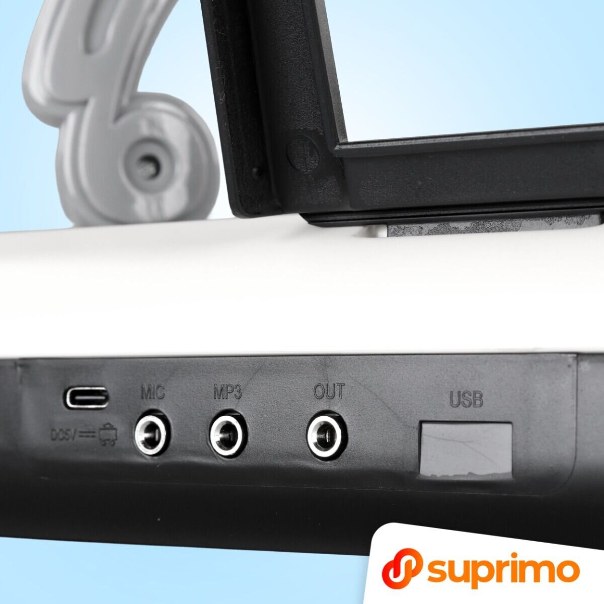 Zbliżenie na panel z portami: DC5V, MIC, MP3, OUT, USB. W prawym dolnym rogu widoczne logo \'suprimo\'.