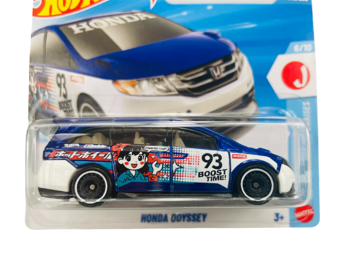 Model samochodu Honda Odyssey w opakowaniu, z grafiką przedstawiającą postać i napisem \'93 BOOST TIME!\'. Na opakowaniu widnieje logo Mattel i oznaczenie wiekowe 3+.