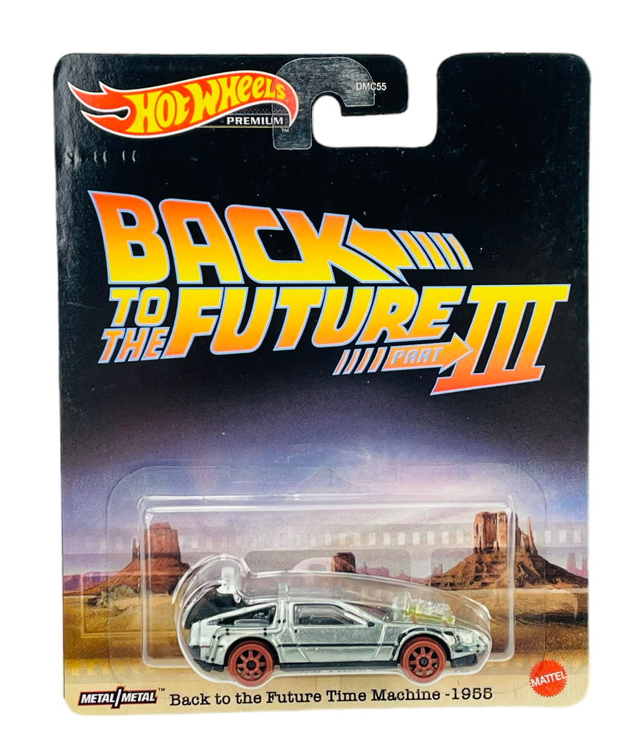 Opakowanie z modelem samochodu Hot Wheels z serii \'Back to the Future Part III\'. Widoczny jest napis \'Back to the Future Time Machine - 1955\' oraz logo Hot Wheels i Mattel.