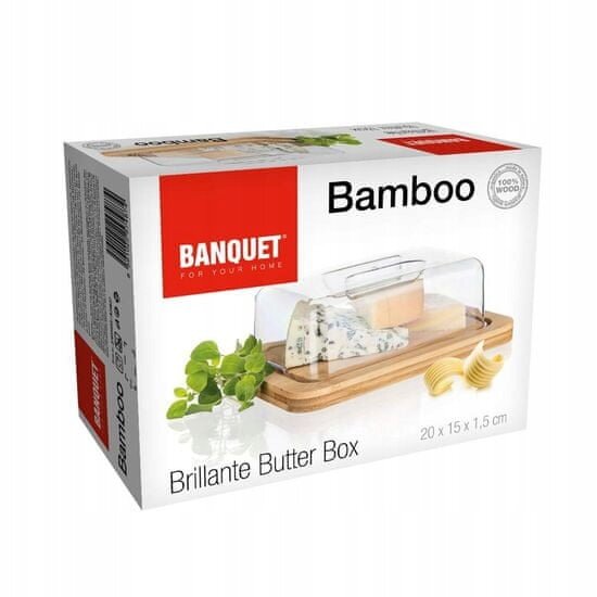 Opakowanie produktu z napisem \'BANQUET FOR YOUR HOME Bamboo Brillante Butter Box 20 x 15 x 1,5 cm\'. Widoczny jest pojemnik na masło z przezroczystą pokrywą i bambusową podstawą, obok którego znajdują się kawałki masła i zielona roślina.