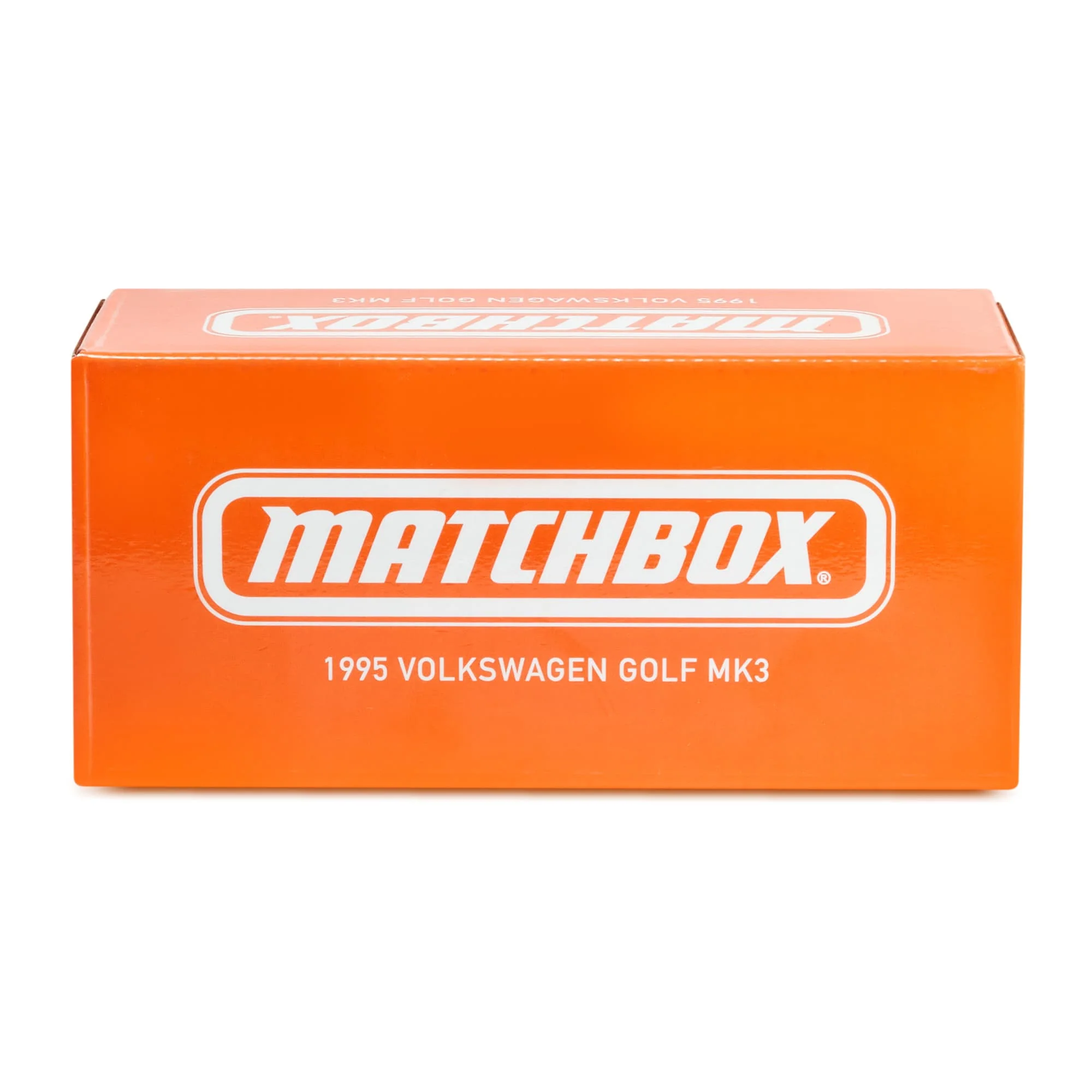 Pomarańczowe pudełko z białym logo \'MATCHBOX\' oraz napisem \'1995 VOLKSWAGEN GOLF MK3\'.