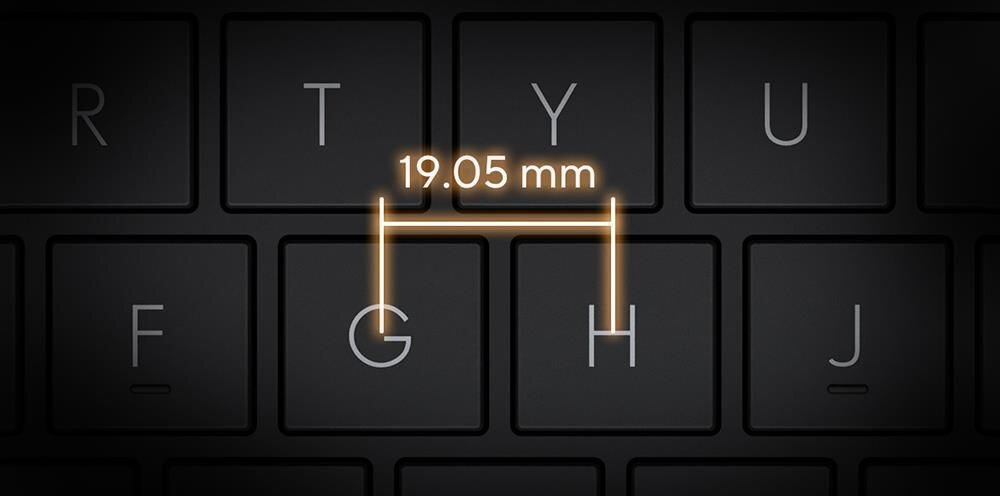 Obraz przedstawia klawiaturę z klawiszami oznaczonymi literami F, G, H, J, R, T, Y, U. Nad klawiszami G i H widoczny jest napis \'19.05 mm\'.
